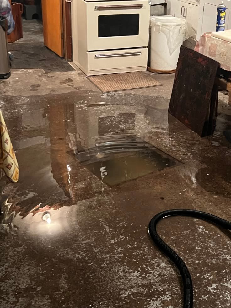 Restoration technician reviewing insurance paperwork with a Greater Houston homeowner