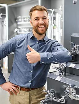 Home 12 A Smiling Face Man Standing and showing a thumb for trust.