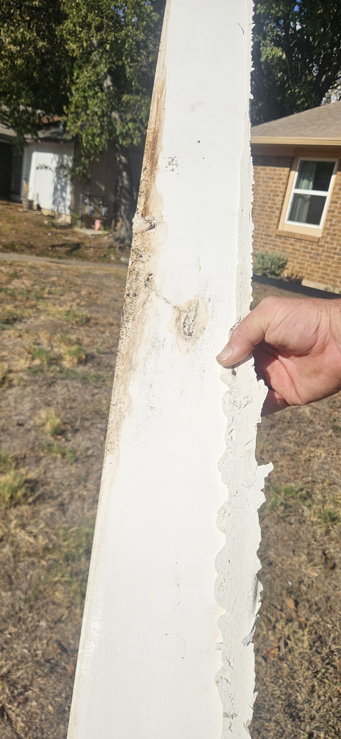 Restoration technician reviewing insurance paperwork with an Austin homeowner